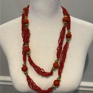 Faux red coral multistrand beaded necklace with gold toned accents